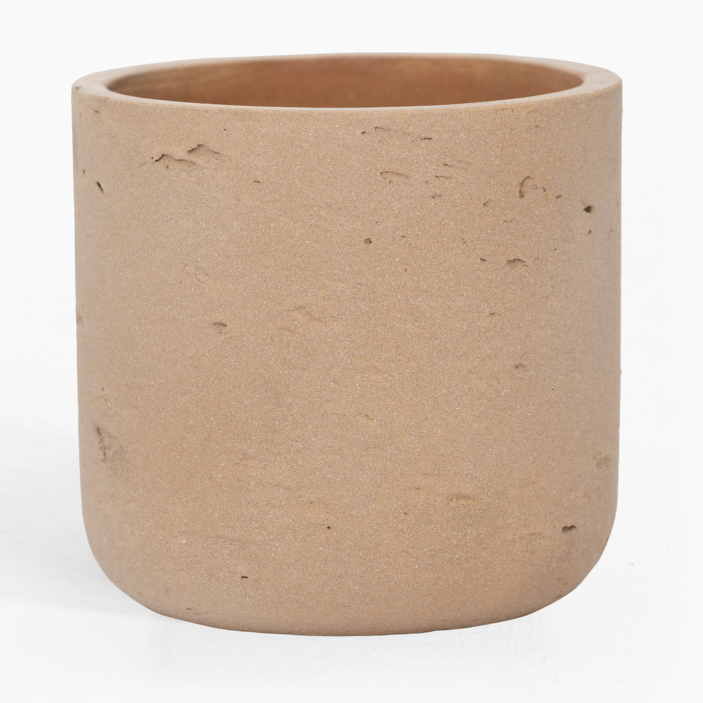 Beige ceramic planter on a white background
