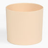 Beige cylindrical pot on a white background