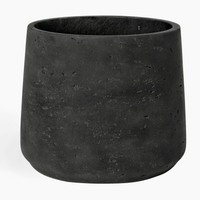 Black textured planter on a white background