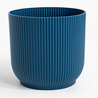 Blue ribbed pot on a white background