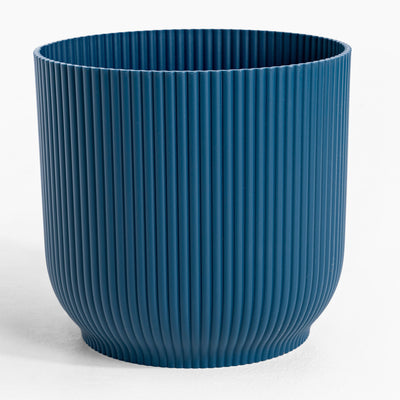 Blue ribbed pot on a white background