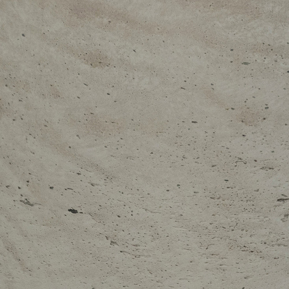 Close-up of a textured beige surface with small variations in color.