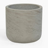 Concrete pot with textured surface on a white background