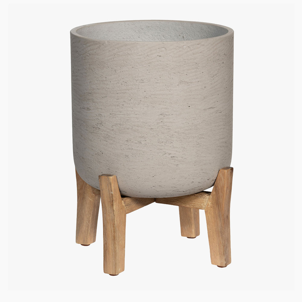 Gray textured planter with wooden stand on a white background