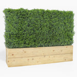 Rectangular wooden planter with artificial greenery on a white background