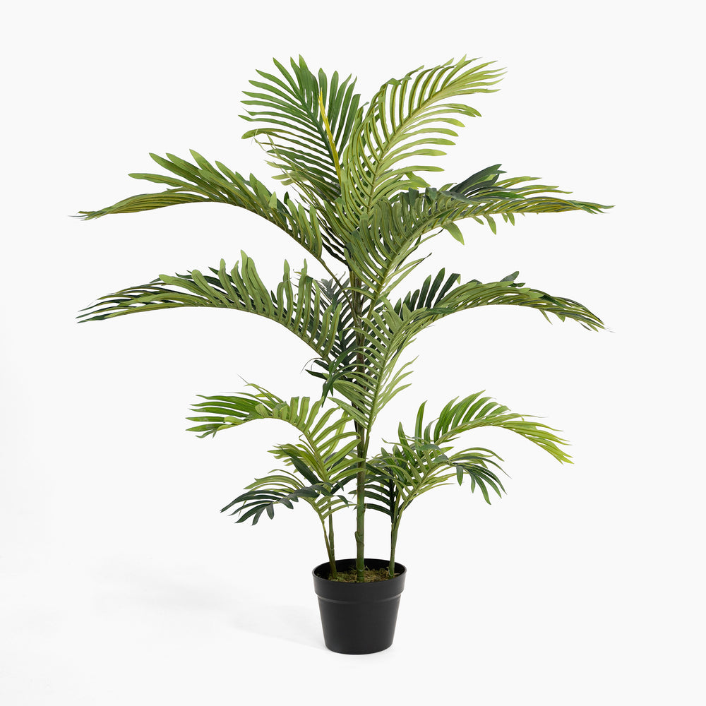 Potted artificial palm plant on a white background