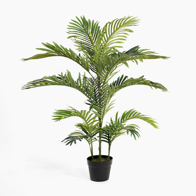 Potted artificial palm plant on a white background