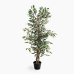 Artificial potted plant with green leaves on a white background