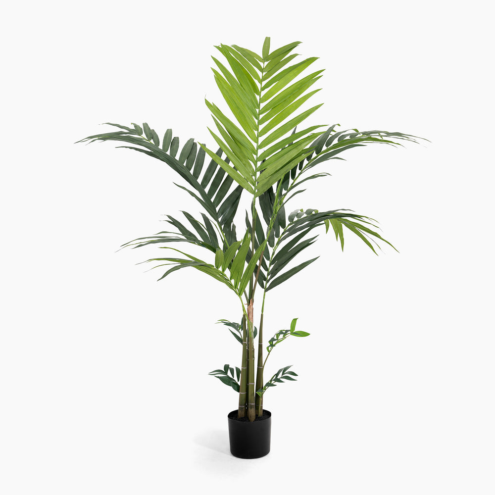 Potted artificial palm plant on a white background