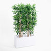 Artificial bamboo plant in a white rectangular planter on a white background