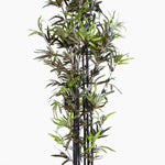 Artificial bamboo plant with green leaves on a white background