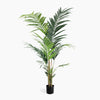 Potted artificial palm plant on a white background