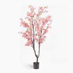 Potted artificial cherry blossom tree with pink flowers on a white background