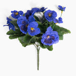 Bouquet of blue flowers with green leaves on a white background