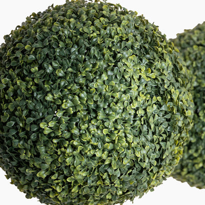 Artificial green bush ball on a white background