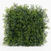 Square piece of artificial greenery on a white background