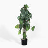Artificial potted plant with green leaves on a white background