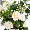 Bouquet of white roses and greenery on a white background