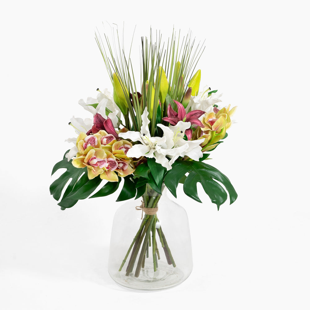 Bouquet of flowers in a clear vase on a white background