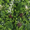 Various types of green plants arranged in a decorative pattern