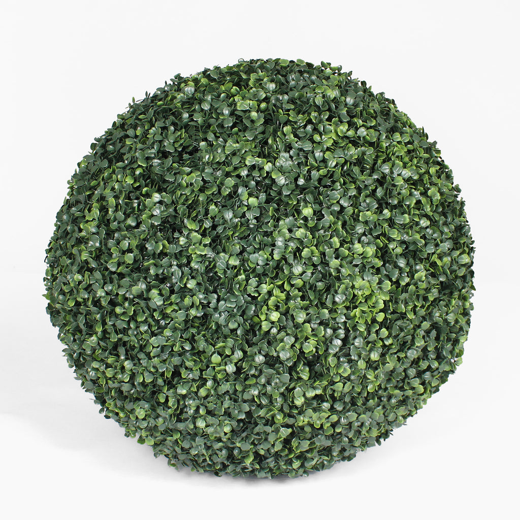 Artificial boxwood ball on a white background