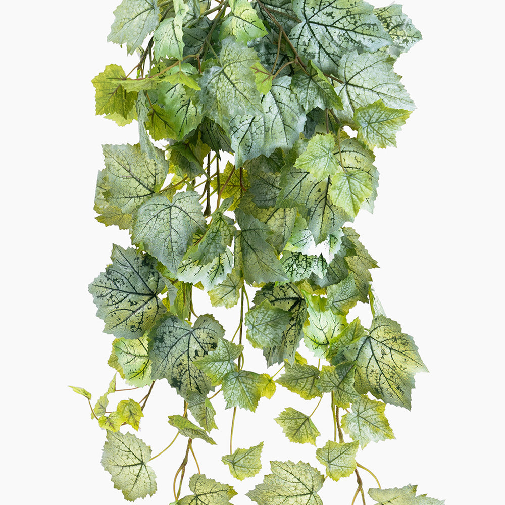 Artificial green leaf garland on a white background
