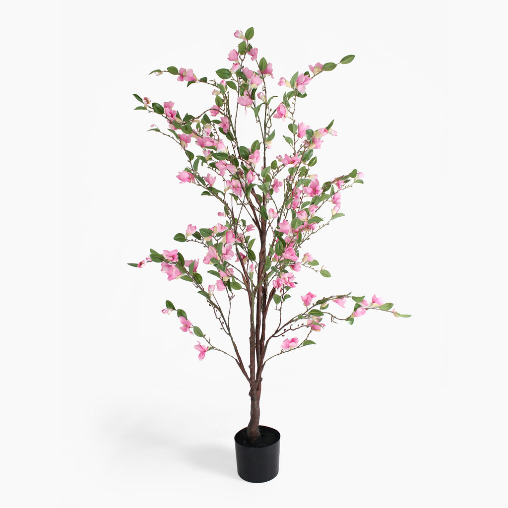 Artificial cherry blossom tree with pink flowers in a pot on a white background