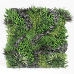Artificial vertical garden wall with various green plants on a white background