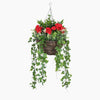 Hanging basket with red flowers and green leaves on a white background