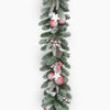 Decorative Christmas garland with pink ornaments and pinecones on a white background
