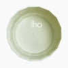 Light green planter opening with 'elho' branding on the inside, on a white background