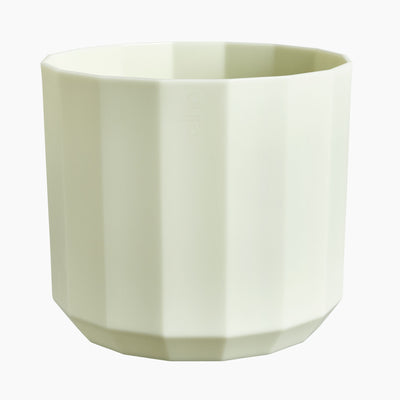 Green geometric planter on a white background