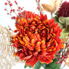 Artificial happy holidays red and gold leaf flower and foliage bunch flower close-up
