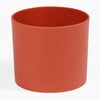 Red cylindrical pot on a white background
