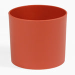 Red cylindrical pot on a white background
