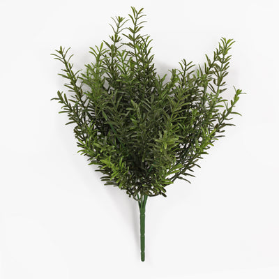 An artificial green leafy plant stem with dense, needle-like foliage, photographed against a clean white background.