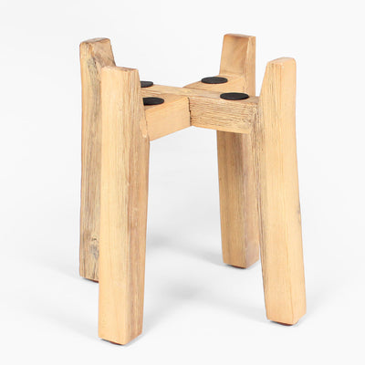 Wooden stool with four legs on a white background