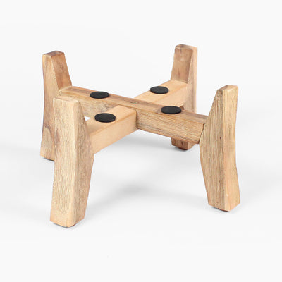 Wooden stool with four legs and circular pads on a white background