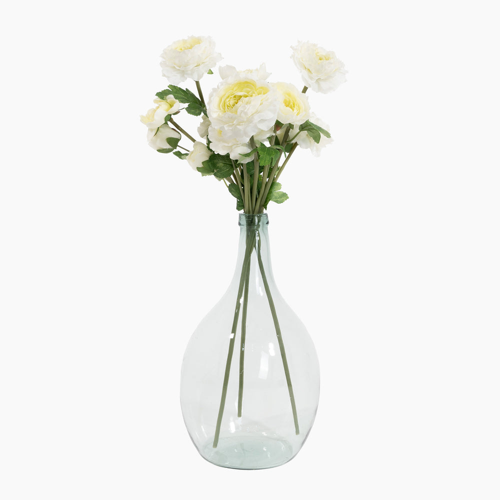Clear glass vase with white flowers on a white background