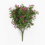 An artificial floral arrangement featuring clusters of small pink flowers with green leaves on a stem, photographed against a plain white background.