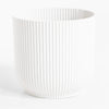 White ribbed vase on a white background