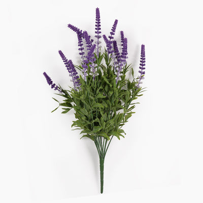 An artificial lavender bouquet with purple flower spikes and green leaves, photographed against a plain white background.
